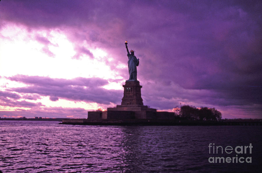 Statue of Liberty After a Purple Storm Photograph by Tom Wurl