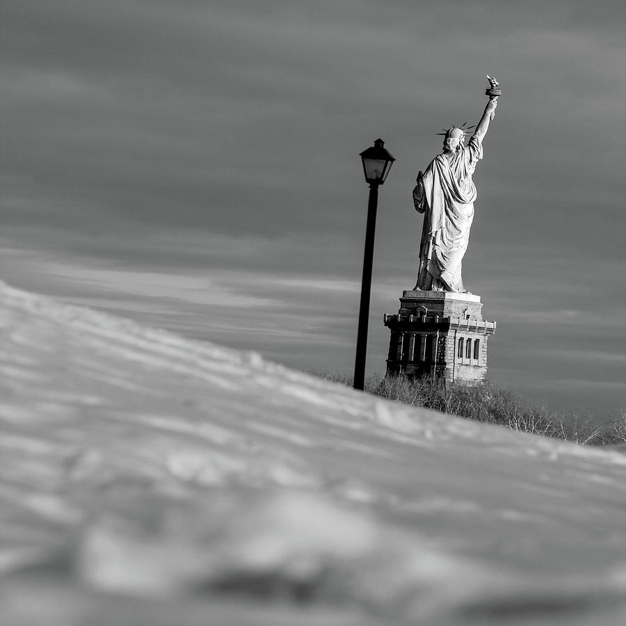 Statue of liberty in a snowy day NY Photograph by Habib Ayat
