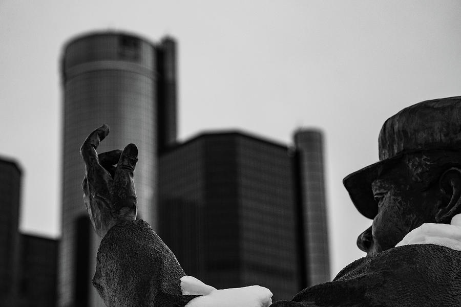 Statue with Renaissance Center in Background in Detroit Michigan in Black and White Photograph by Eldon McGraw