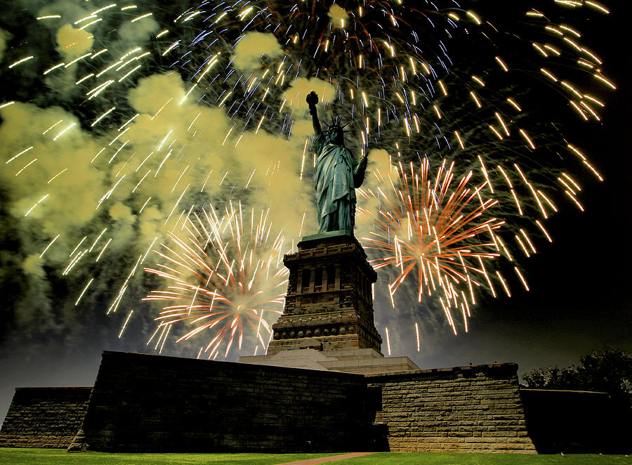 Statue of Liberty with fire works Photograph by Montez Kerr
