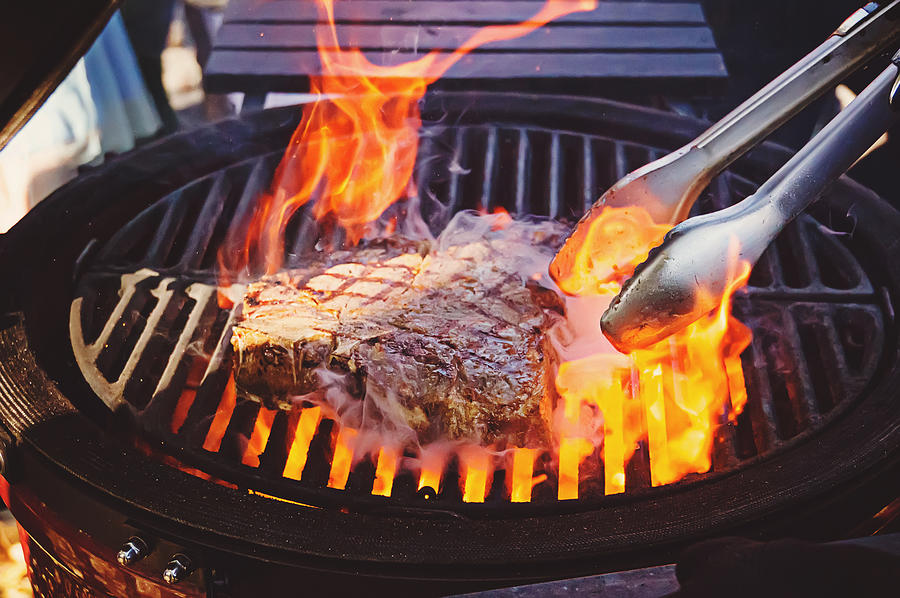 Steak on the grill with flames Photograph by Diy13