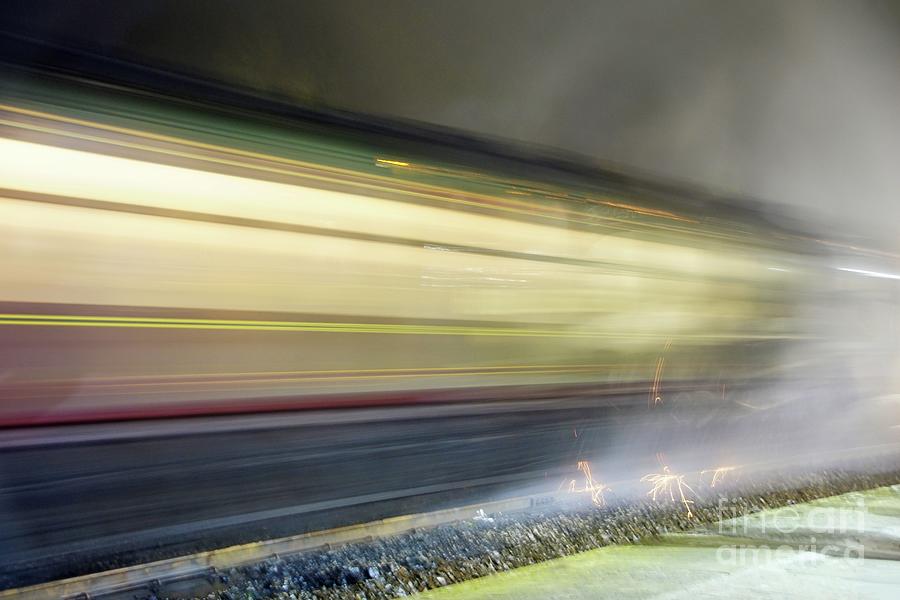 Steam train at speed at night. Photograph by David Birchall