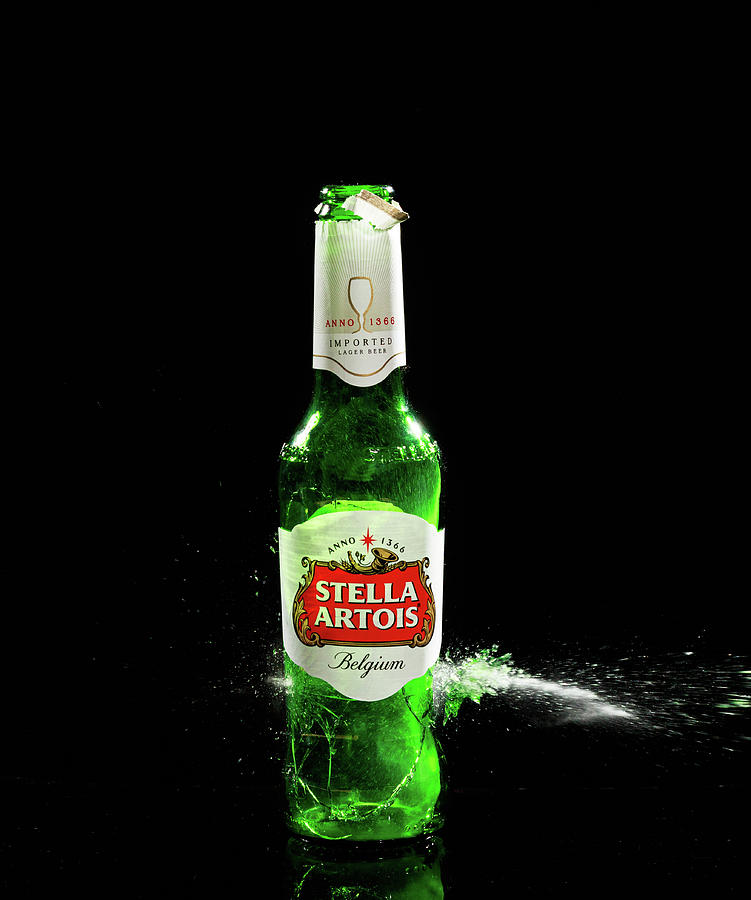Stella Artois beer bottle exploding Photograph by David Ilzhoefer