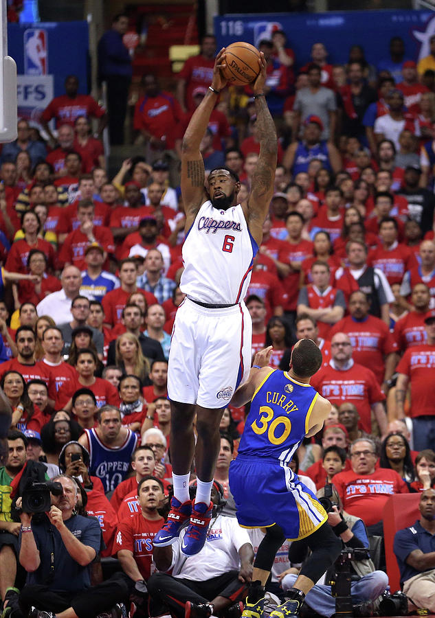 Stephen Curry Photograph - Stephen Curry and Deandre Jordan by Stephen Dunn