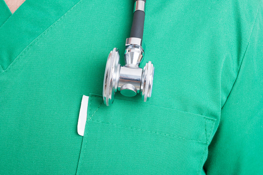 Stethoscope on medical uniform Photograph by Catalin205