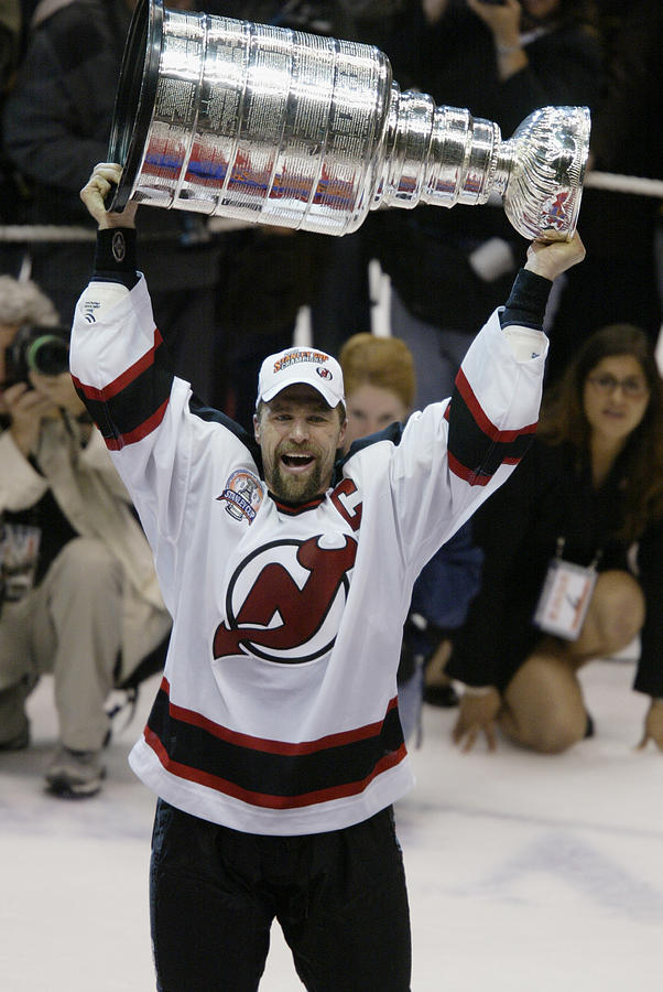 Stevens holds up the Stanley Cup Photograph by Al Bello