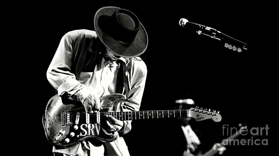 Stevie Ray Vaughan in concert Photograph by Action