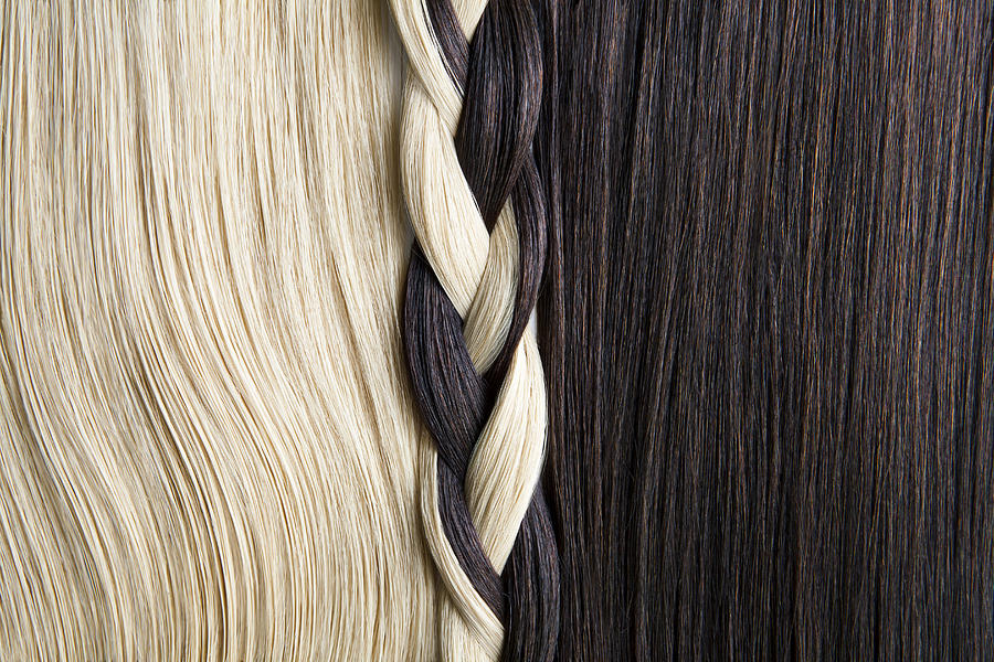 Still life of blond and brown hair, braided. Photograph by Andreas Kuehn
