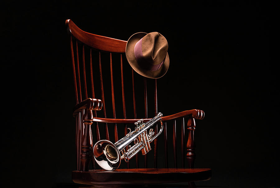 Still life of my trumpet, fedora and rocking chair. Photograph by David Ilzhoefer