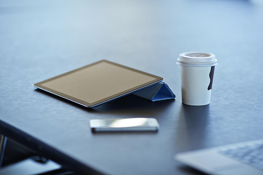 Still-life of tablet, to-go coffee & phone Photograph by Klaus Vedfelt