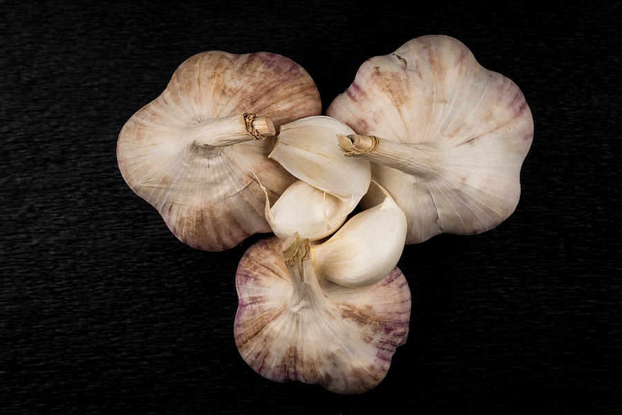 Still Life Photo Of Organic Whole Garlic On Black Stone Plate Photograph by R.Tsubin