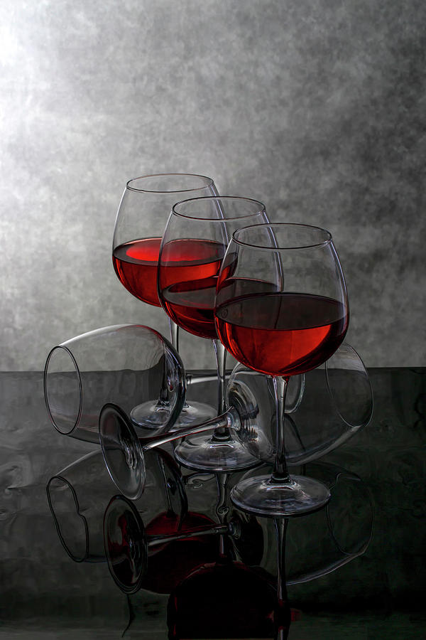 Still life with wine glasses on a reflective surface Photograph by ...