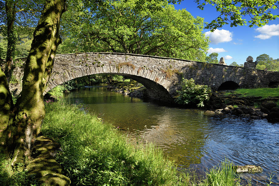 Lake District National Park Photograph - Stone arch Pelter Bridge in evening sun over the River Rothay at by Reimar Gaertner