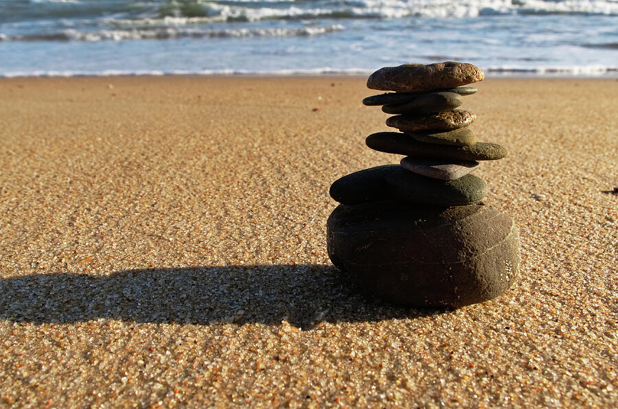 Stone balance on the beach Photograph by Angelo DeVal