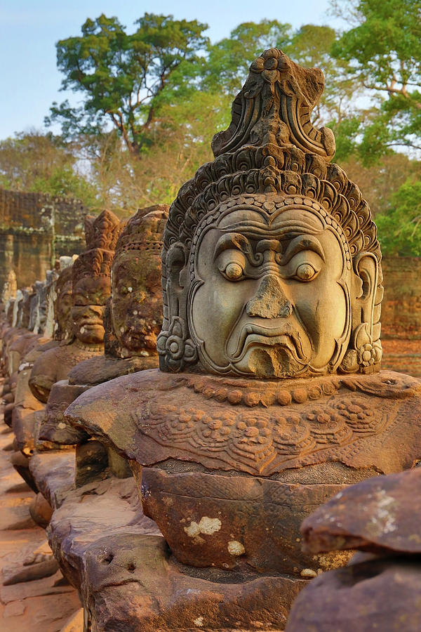Stone carved statues of Devas in Cambodia Photograph by Mikhail Kokhanchikov