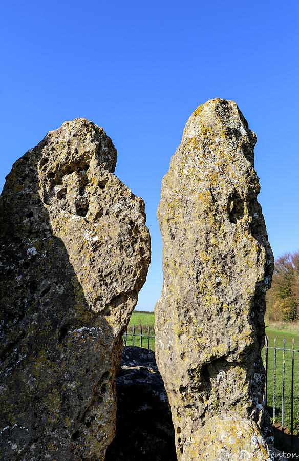 Ancient Monuments Photograph - Stone heads and faces. The Whispering Knights. by Martin Fenton