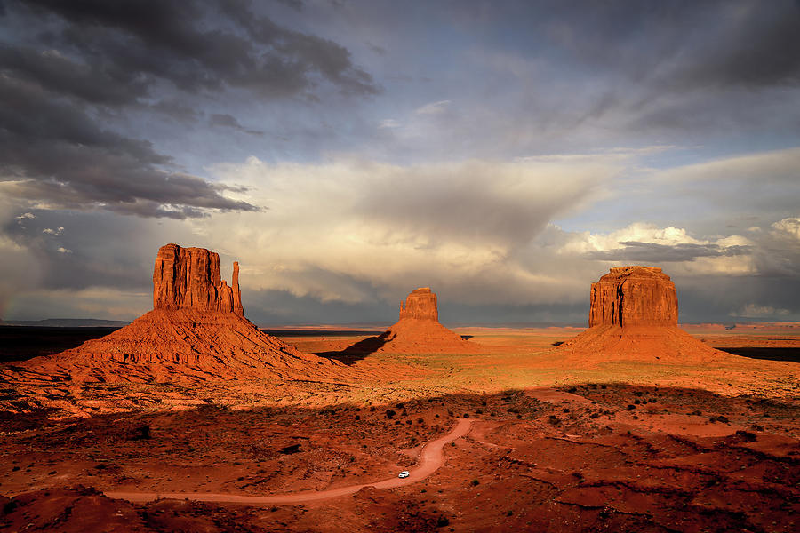 Storm At Sunset At Monument Valley Photograph by Alberto Zanoni