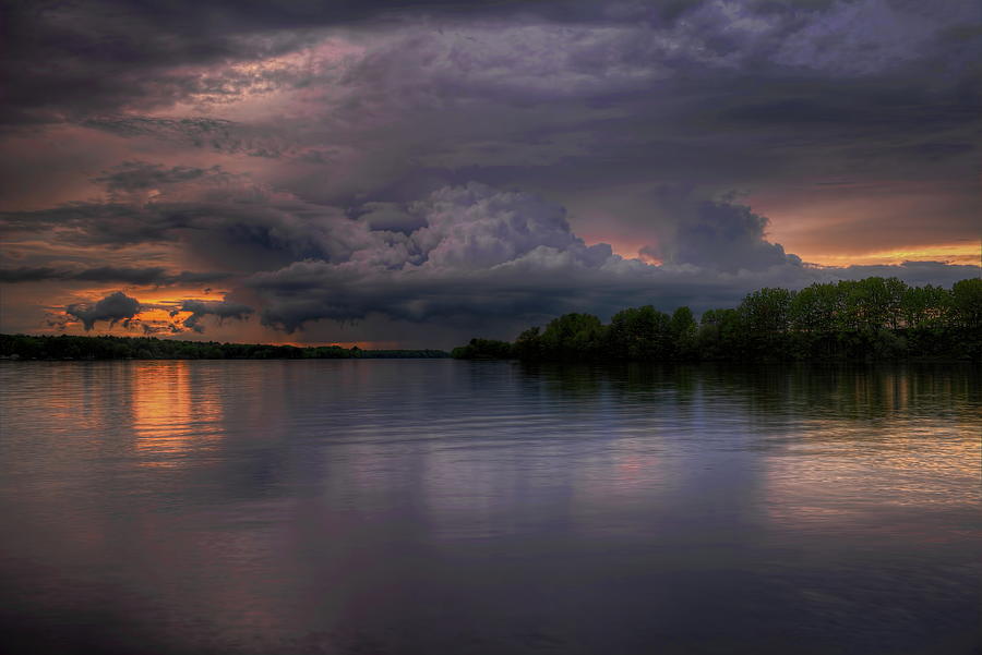 Storm Cloud And Golden Glow Over Lake Wausau Photograph by Dale Kauzlaric