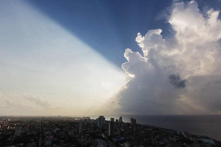 Storm clouds and sunbeams over Havana cityscape, Havana, Cuba Photograph by Jeremy Woodhouse