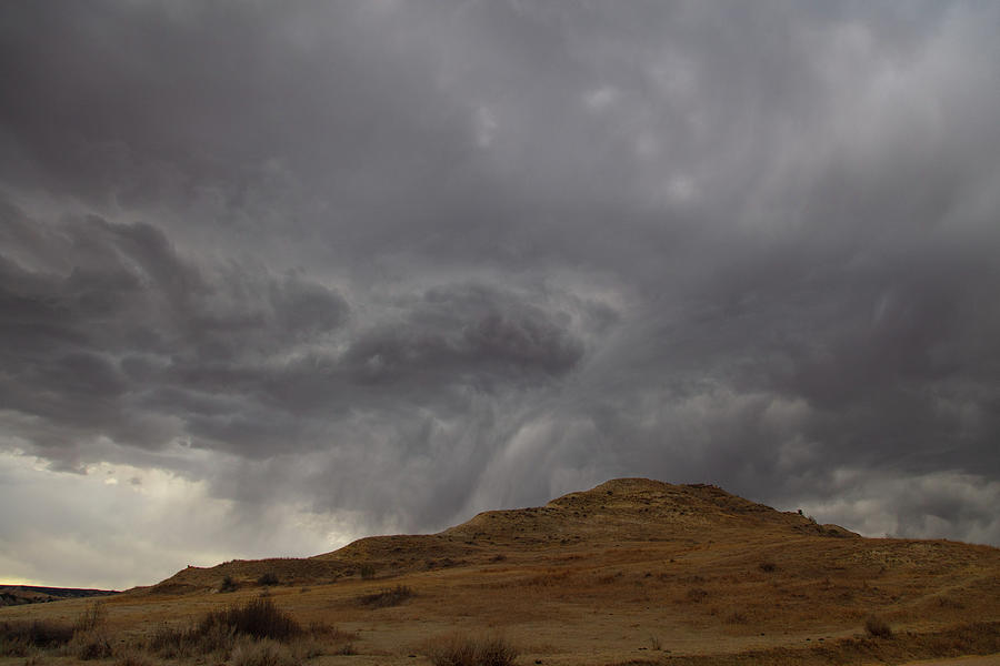 Storm clouds over mountain at Theodore Roosevelt National Park in North Dakota Photograph by Eldon McGraw