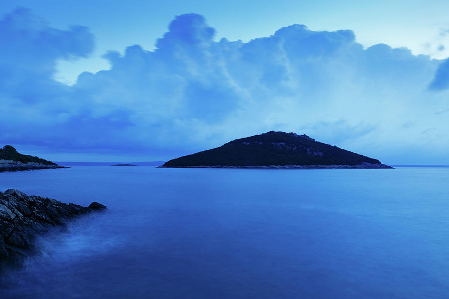 Storm moving in over Veli Osir Island at dawn Photograph by Ian Middleton