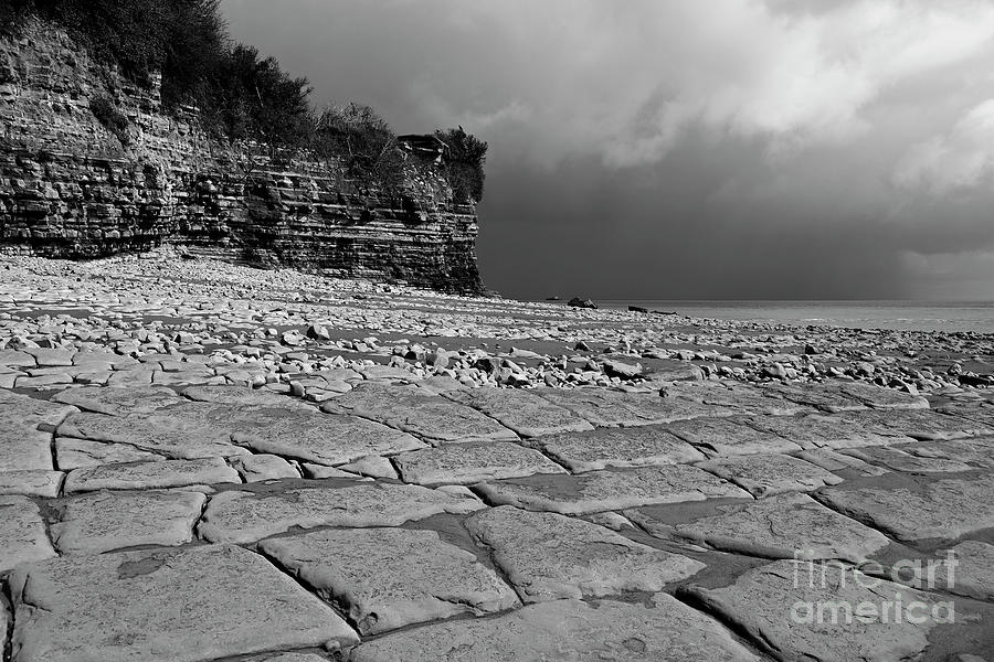 Stormy skies at Lavernock Point in black and white South Wales UK Photograph by James Brunker