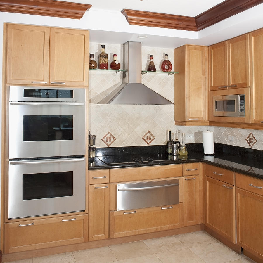 Stove, oven and cabinets in kitchen Photograph by Camilo Morales