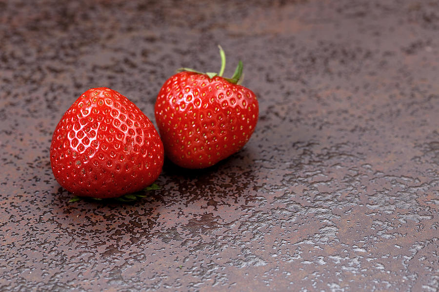 Strawberries on a stone table Photograph by Picmax13