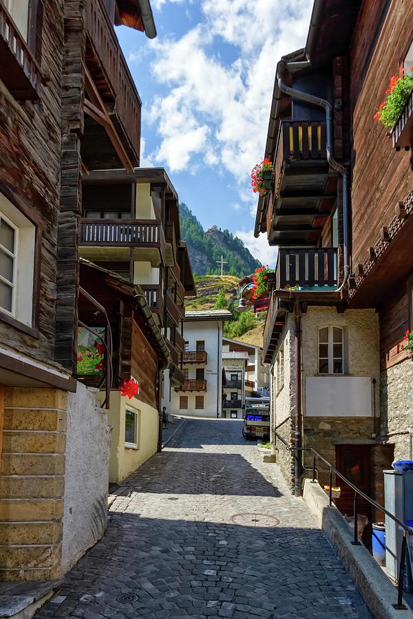Street and typical wooden chalets in Zermatt village, Switzerlan Photograph by Elenarts - Elena Duvernay photo