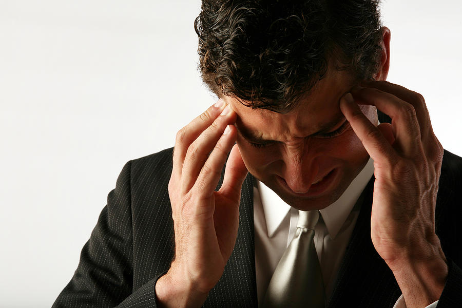 Stressed out Depressed Businessman with Headache Holding Head Photograph by ShaneKato
