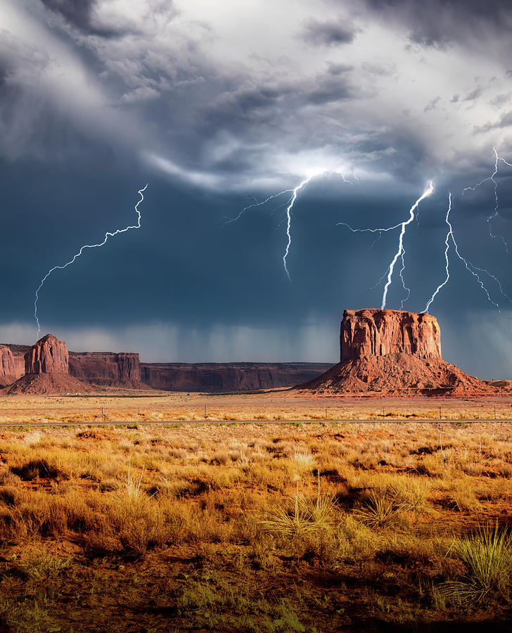 Strike in Monument Valley Photograph by G Lamar Yancy