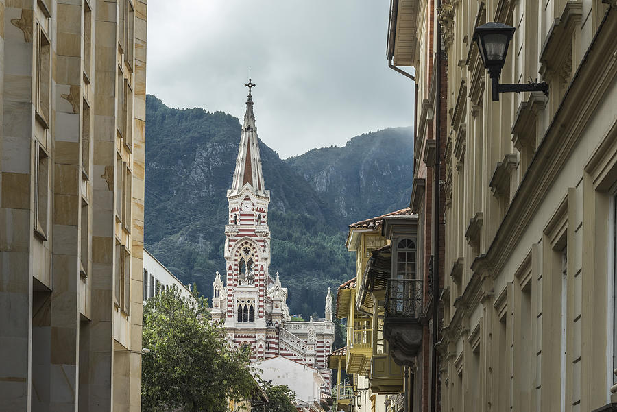 Stripe spire of El Carmen church as veiwed from narrow streets in La Candelaria neighborhood in Bogota, Colombia Photograph by Richard Silver Photo