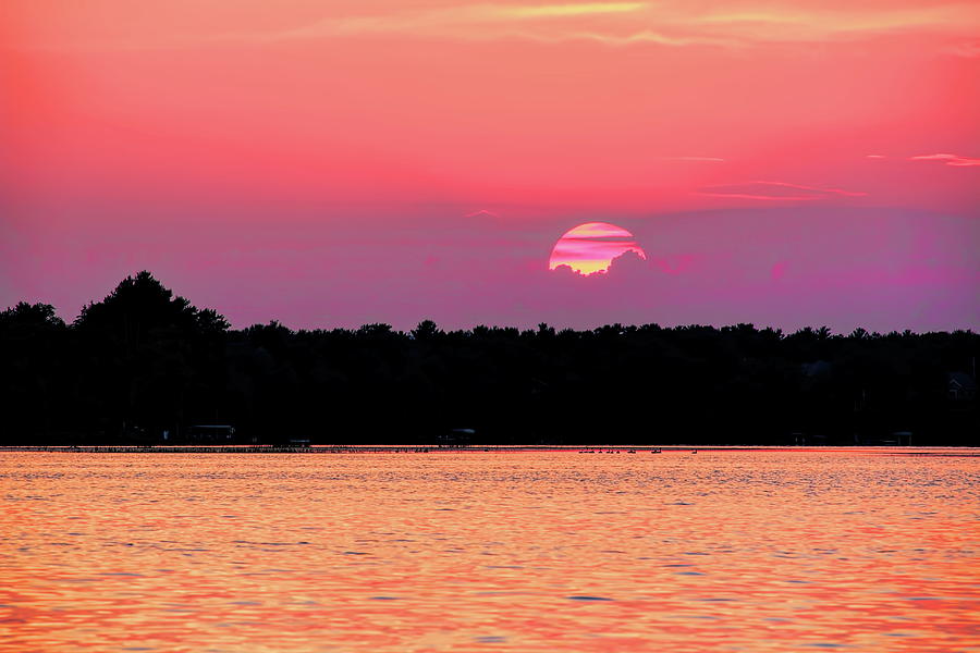 Striped Setting Sun Over Water Photograph by Dale Kauzlaric