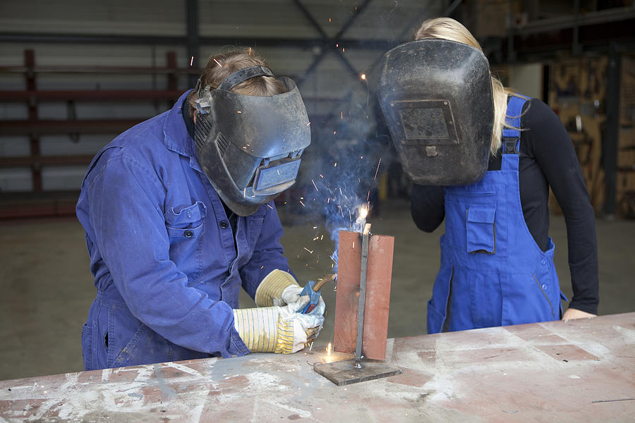 Student making notes. Learning for welder. Photograph by BartCo