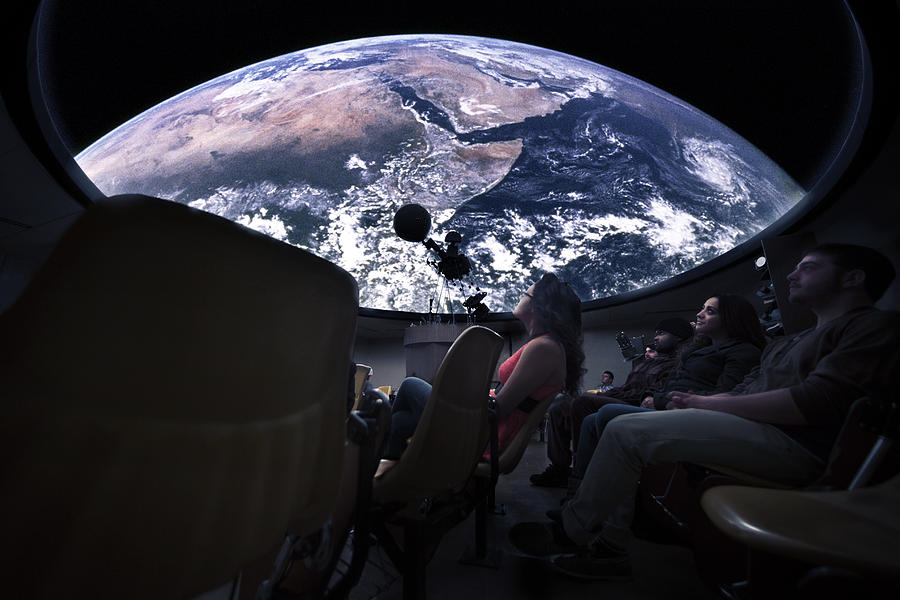Students watching Earth in planetarium Photograph by Hill Street Studios