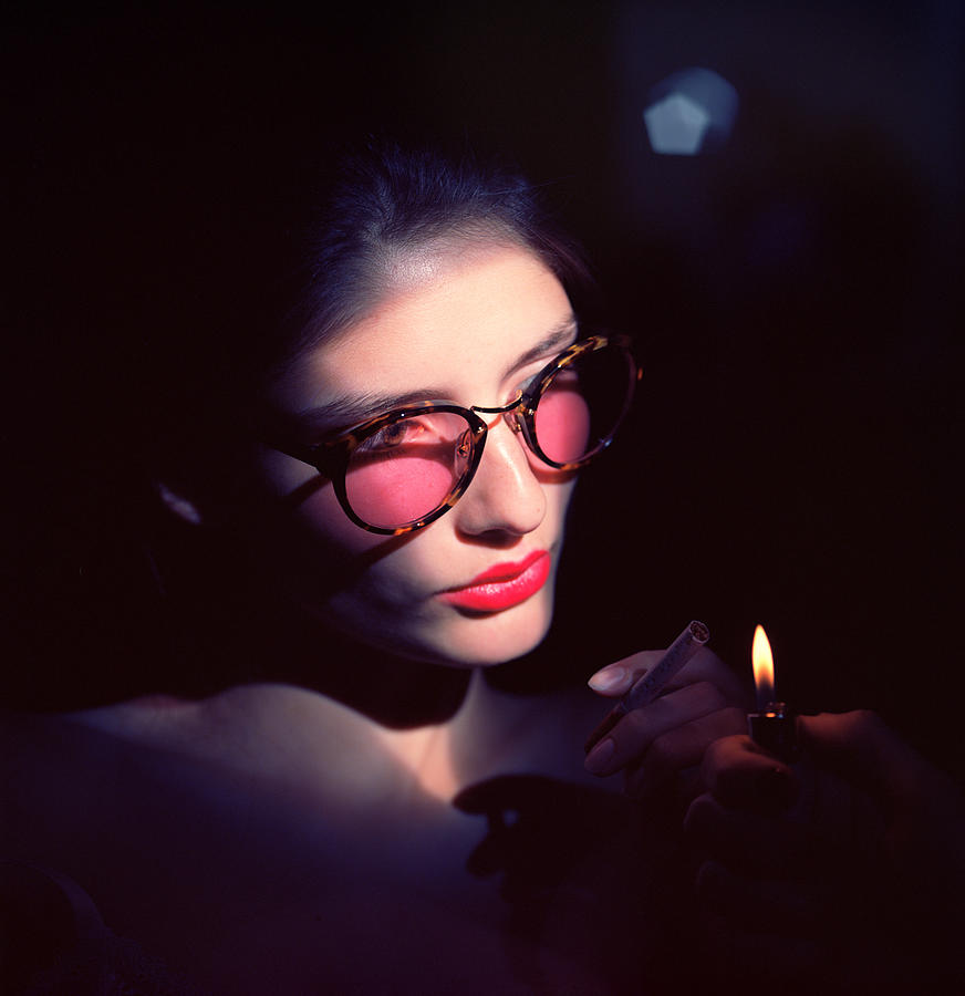Studio portrait of young woman wearing glasses Photograph by Andriy Onufriyenko