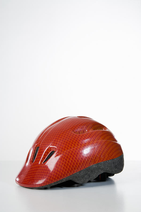 Studio shot of a bicycle helmet Photograph by Adam Burn