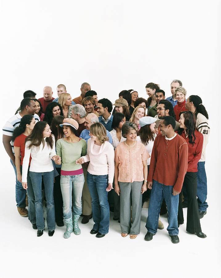 Studio Shot of a Large Mixed Age, Multiethnic Group of Men and Women Talking to Each Other Photograph by Digital Vision.