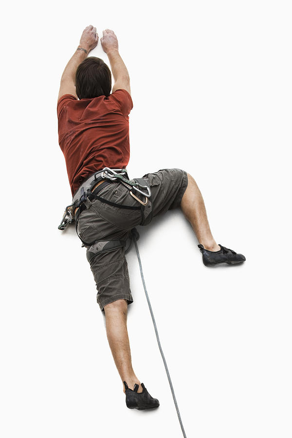 Studio shot of a male climber Photograph by Mike Kemp