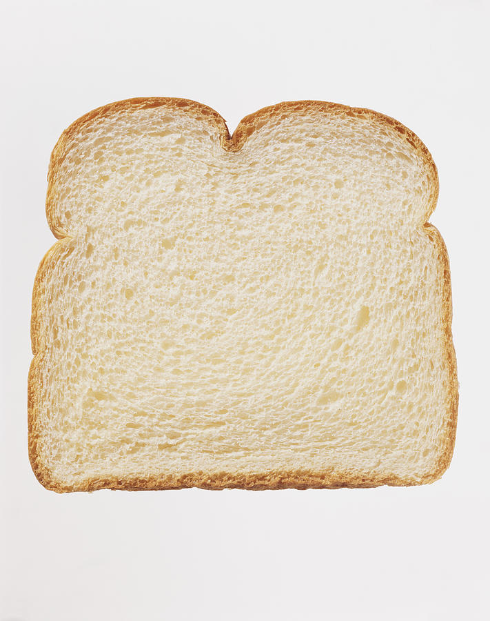 Studio Shot of a Slice of White Bread Against a White Background Photograph by Digital Vision.