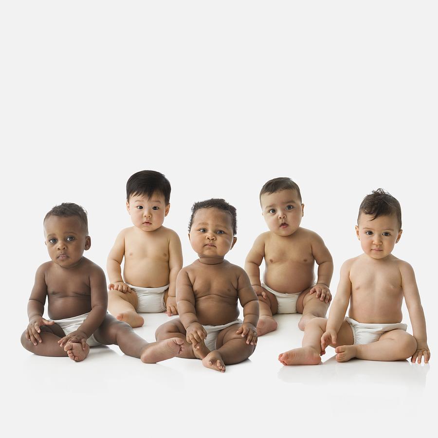Studio shot of babies in diapers sitting Photograph by Jose Luis Pelaez Inc