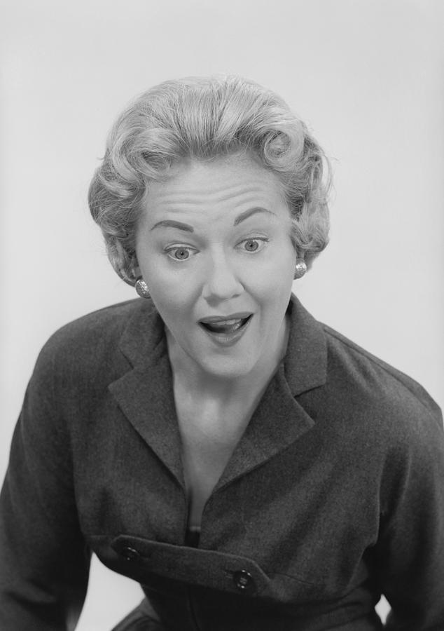Studio shot of mid adult woman with facial expression Photograph by George Marks