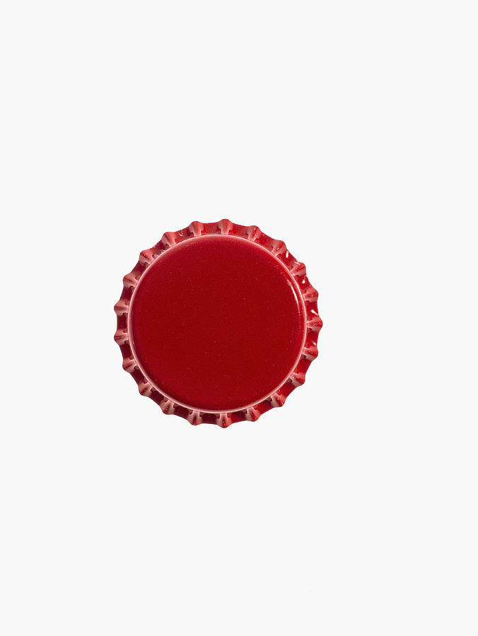 Studio shot of red bottle cap Photograph by David Arky
