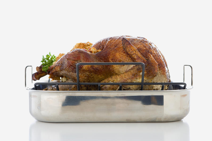 Studio shot of roasted turkey in pan Photograph by Jose Luis Pelaez Inc