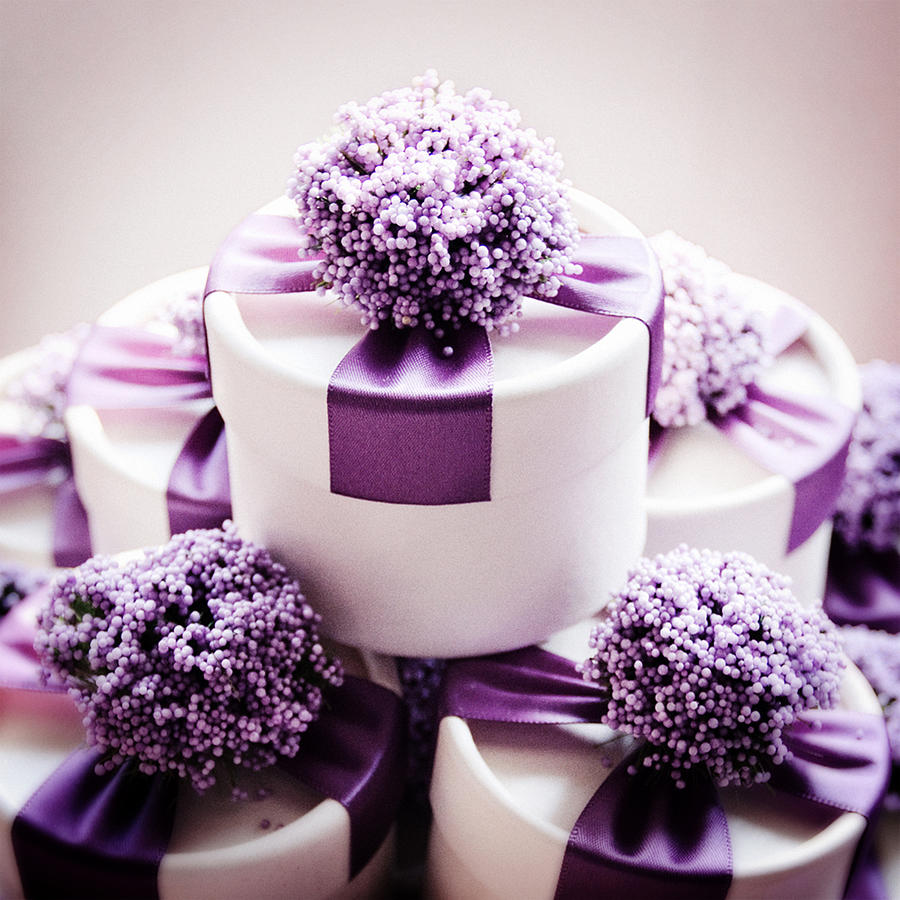 Studio shot of wedding candy boxes with purple ribbons Photograph by TinaWang