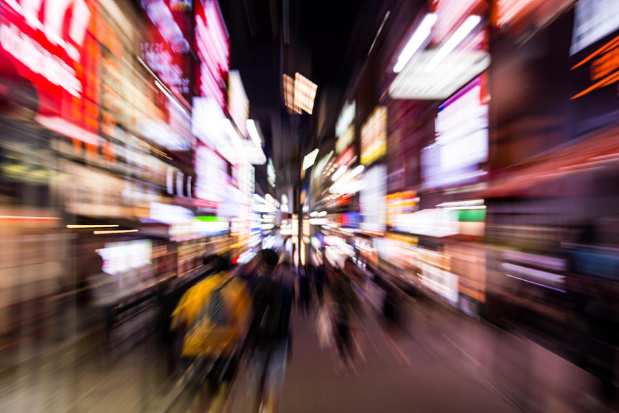 Stunning motion view of the streets the Shibuya at night with forward motion, nice vanishing point and bright lights. Photograph by Artur Debat