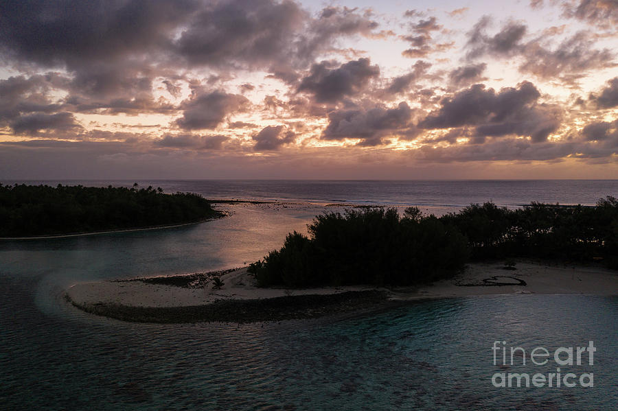 Stunning sunrise over the Muri beach and lagoon in Rarotonga in  Photograph by Didier Marti