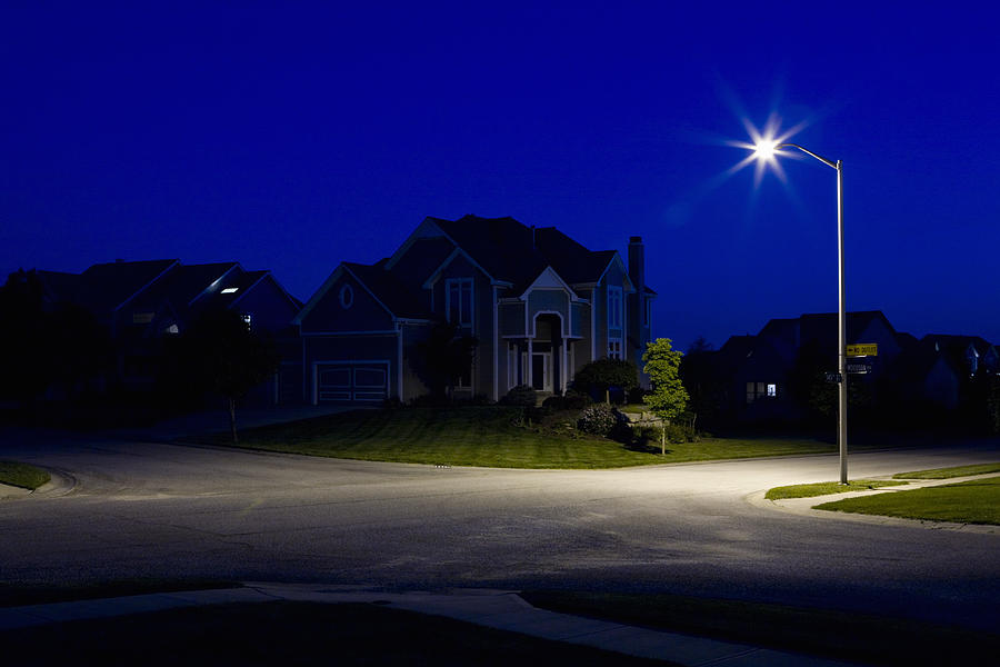 Suburban houses at night Photograph by Patrick Strattner
