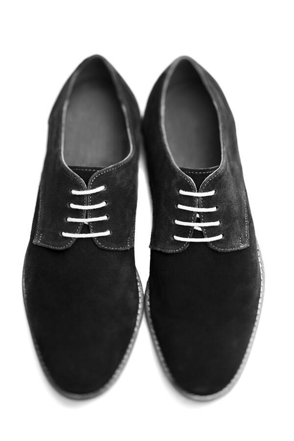 Suede shoes on a white background Photograph by Richard Boll