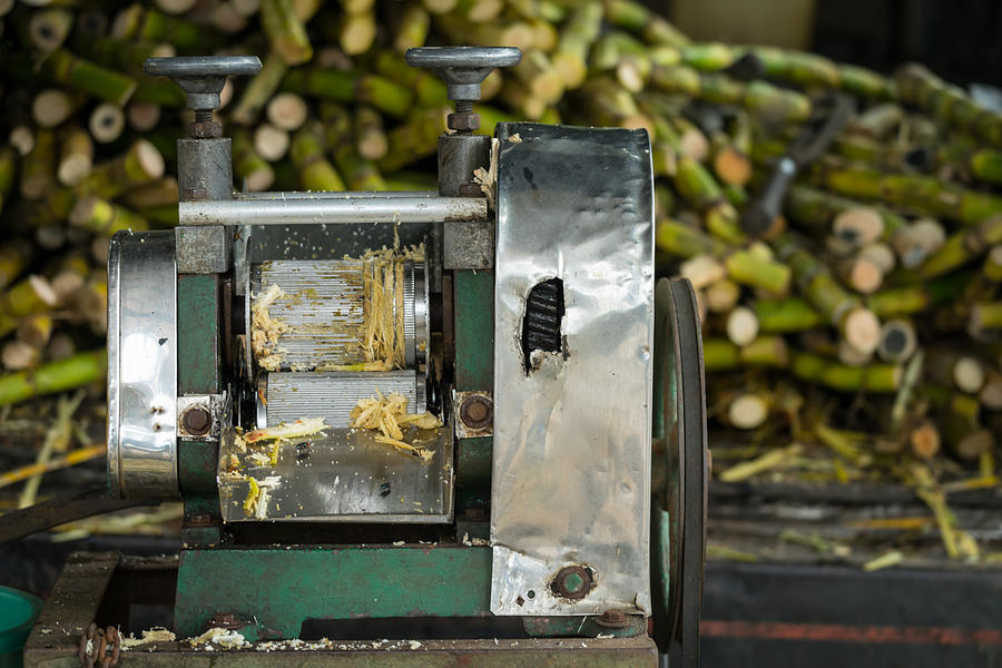 Sugarcane juice machine at street of Kota Baharu, Malaysia. Its an extremely common street drink in Asean. Photograph by Shaifulzamri